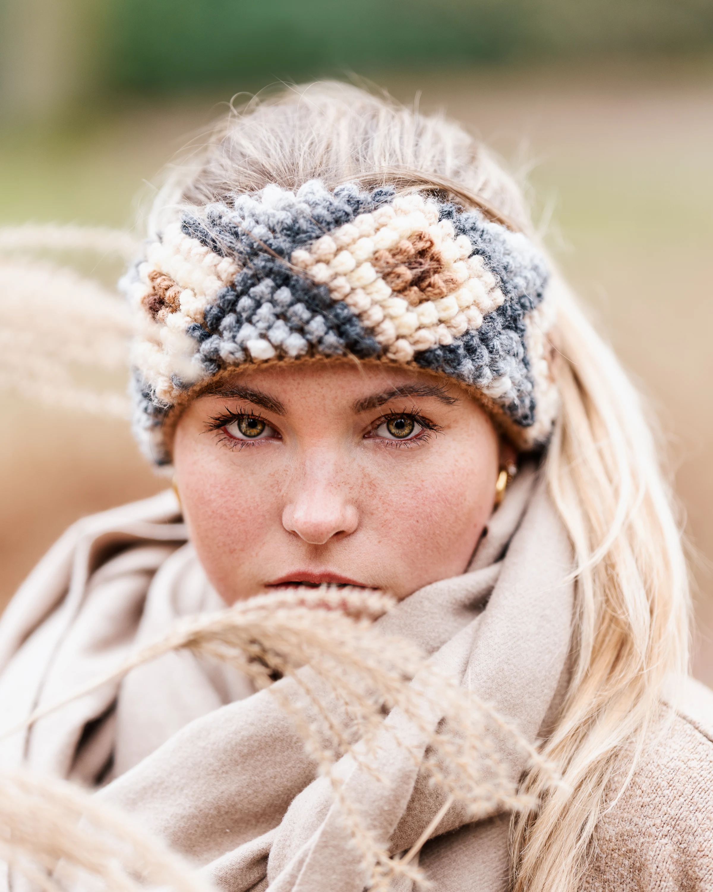 Centered winter portrait of a woman wearing a headband